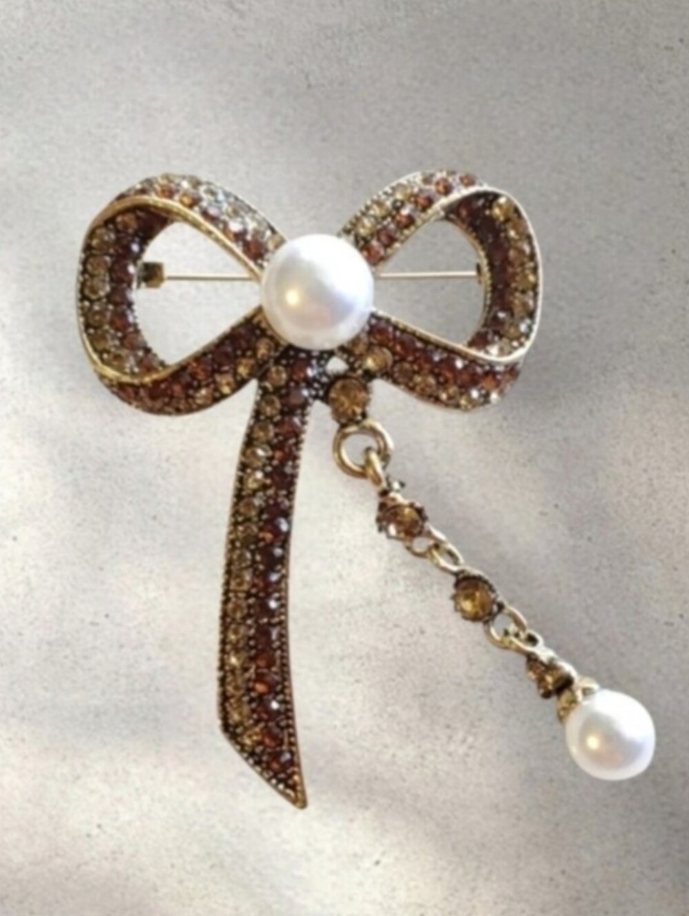 Amber Rhinestone Bow Brooch with Pearl Accents